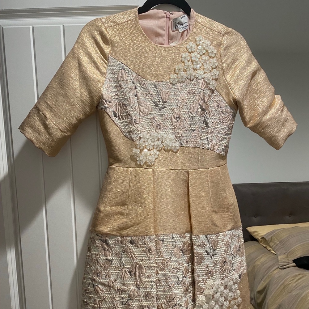 Rose good dress with lots of detail on it